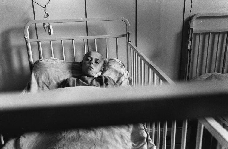 At the Kosevo hospital, children are treated for wounds sustained during a Serbian mortar attack on their school. A teacher and three children were killed, 21 wounded. Having lived in the city, Serbian forces who besiege Sarajevo are expected to know the exact location of every institution. Later Bosnian Serb leader Radovan Karadzic claimed the shells were coming from Croat lines.. which are out of reach of mortar shells. Sarajevo. 1993.