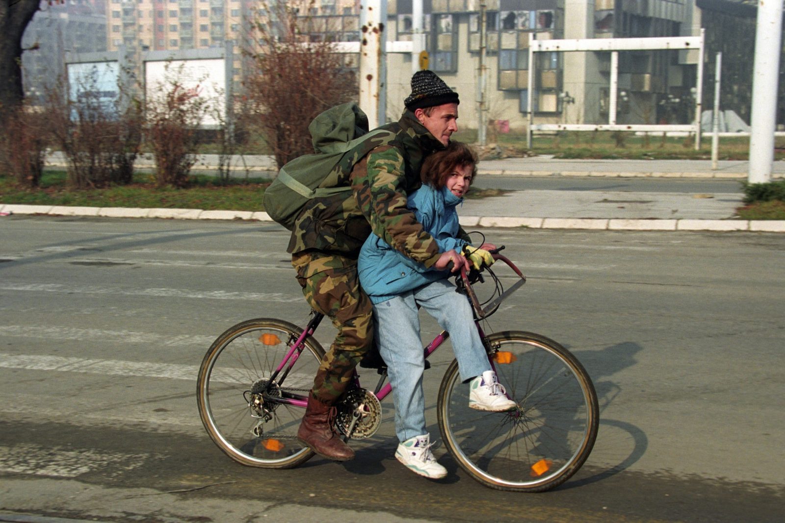 A Bosnian soldier gives his daughter a bicycle ride along a main street in Sarajevo, Bosnia and Hercegovina, 9 December 1994. EPA/ANJA NIEDRINGHAUS