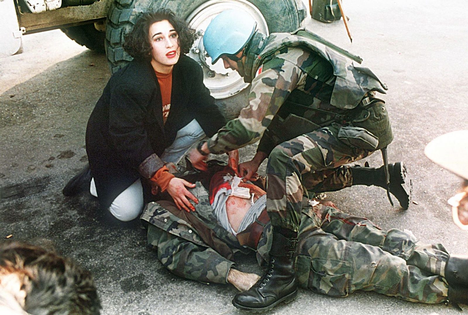 This picture was taken in 1994 in Sarajevo on so called 'sniper alley'. A Bosnian soldier was shot and killed instantly. A Bosnian woman who had just passed by and a French UN soldier tried to save his life but could not. What makes it a picture for me is the face of the woman and her attitude. Nicely dressed and wearing lipstick like she is on her way to an office to start her work EPA/ANJA NIEDRINGHAUS