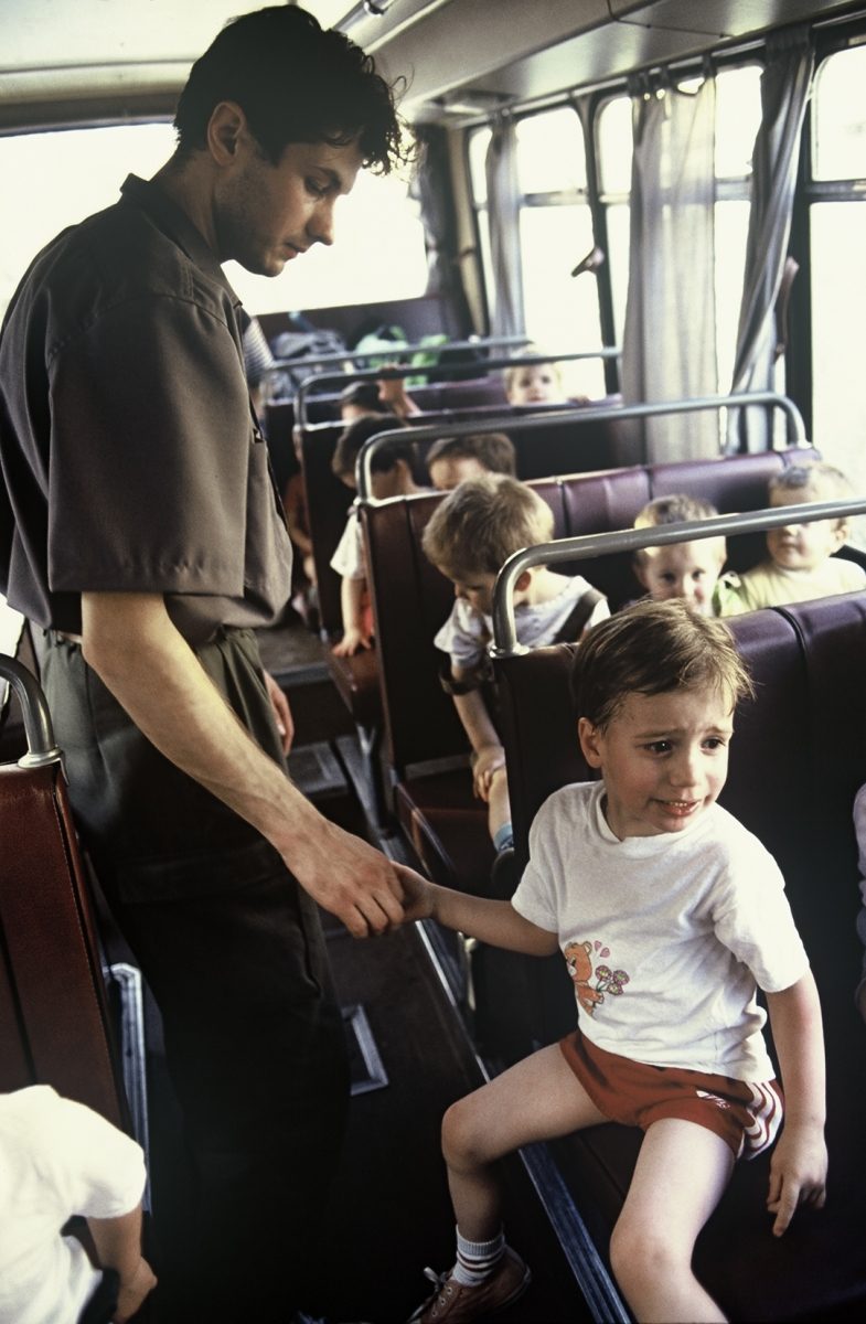 The bus that is supposed to evacuate 54 children from the besieged Sarajevo is ready. A man tries to calm down a little boy. Bosnia and Herzegovina, Sarajevo 01.08.1992
