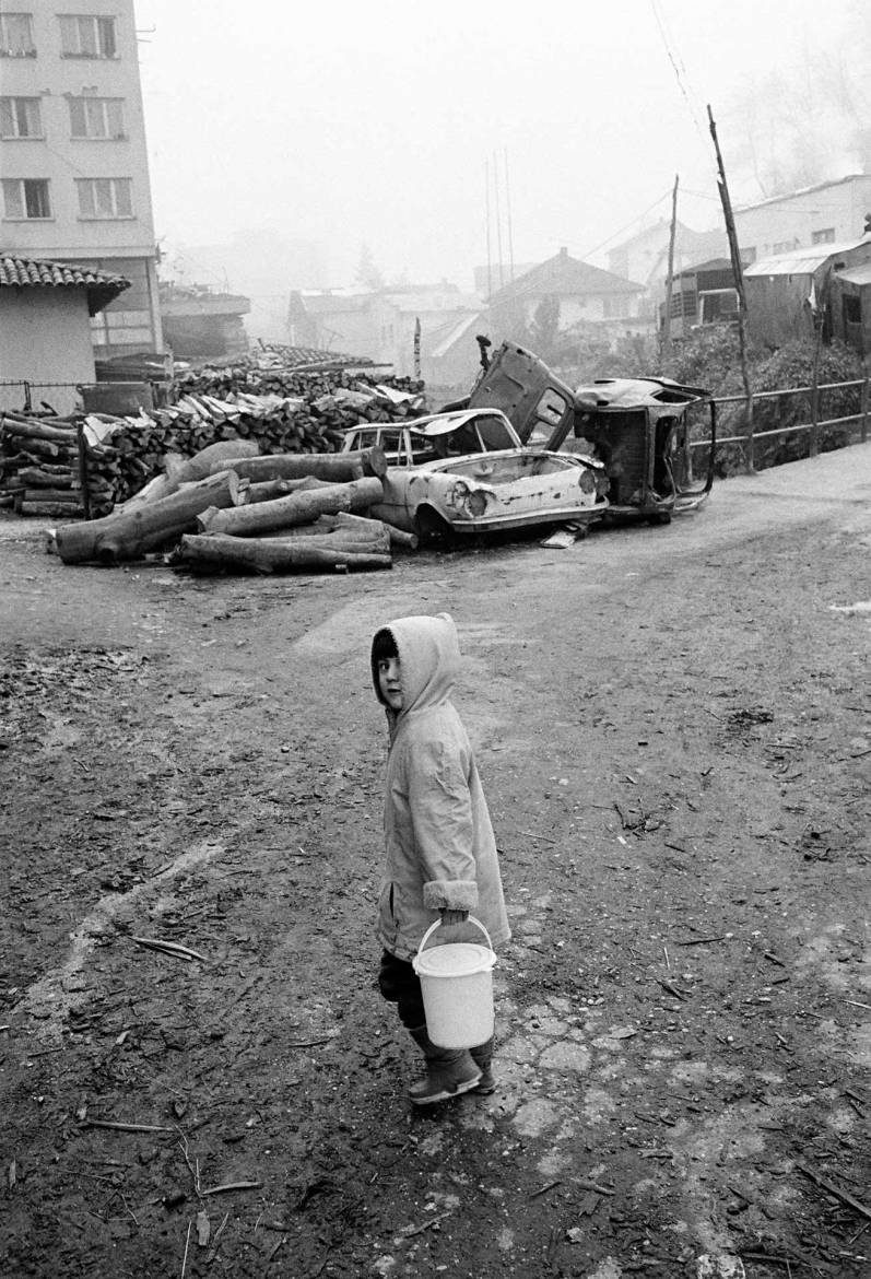 A child carrying a bucket of water in Gorazde, 11November 1995.
