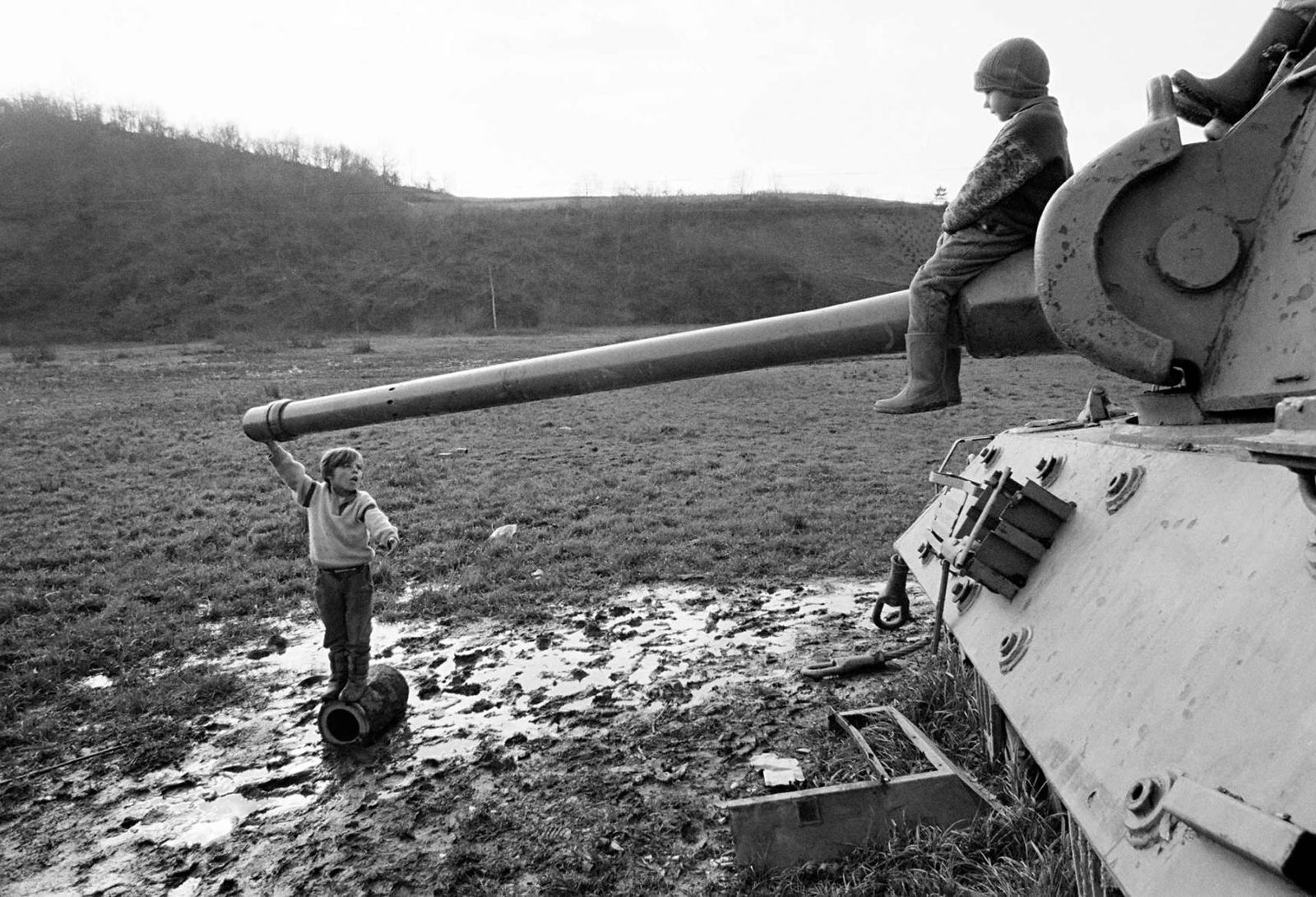 Children playing on a destroyed army tank in a village near Gorazde, 12 November 1995.