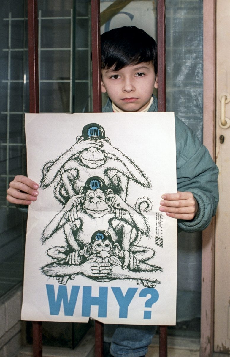 A young boy has a message to give to UN leaders. Sarajevo, 24 November 1992. EPA | DIMITRI MESSINIS
