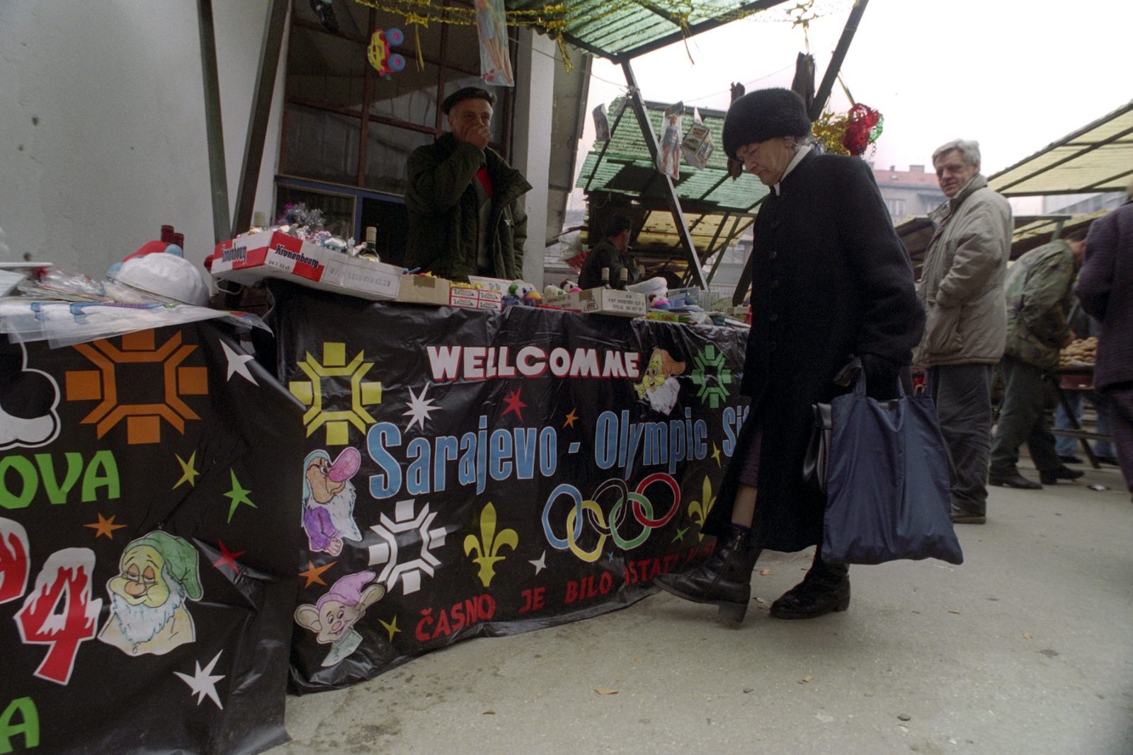 In the central marketplace, a vendor sells souvenirs from the 1984 Olympic Games and other items in Sarajevo, Bosnia and Hercegovina, 09 January 1994.