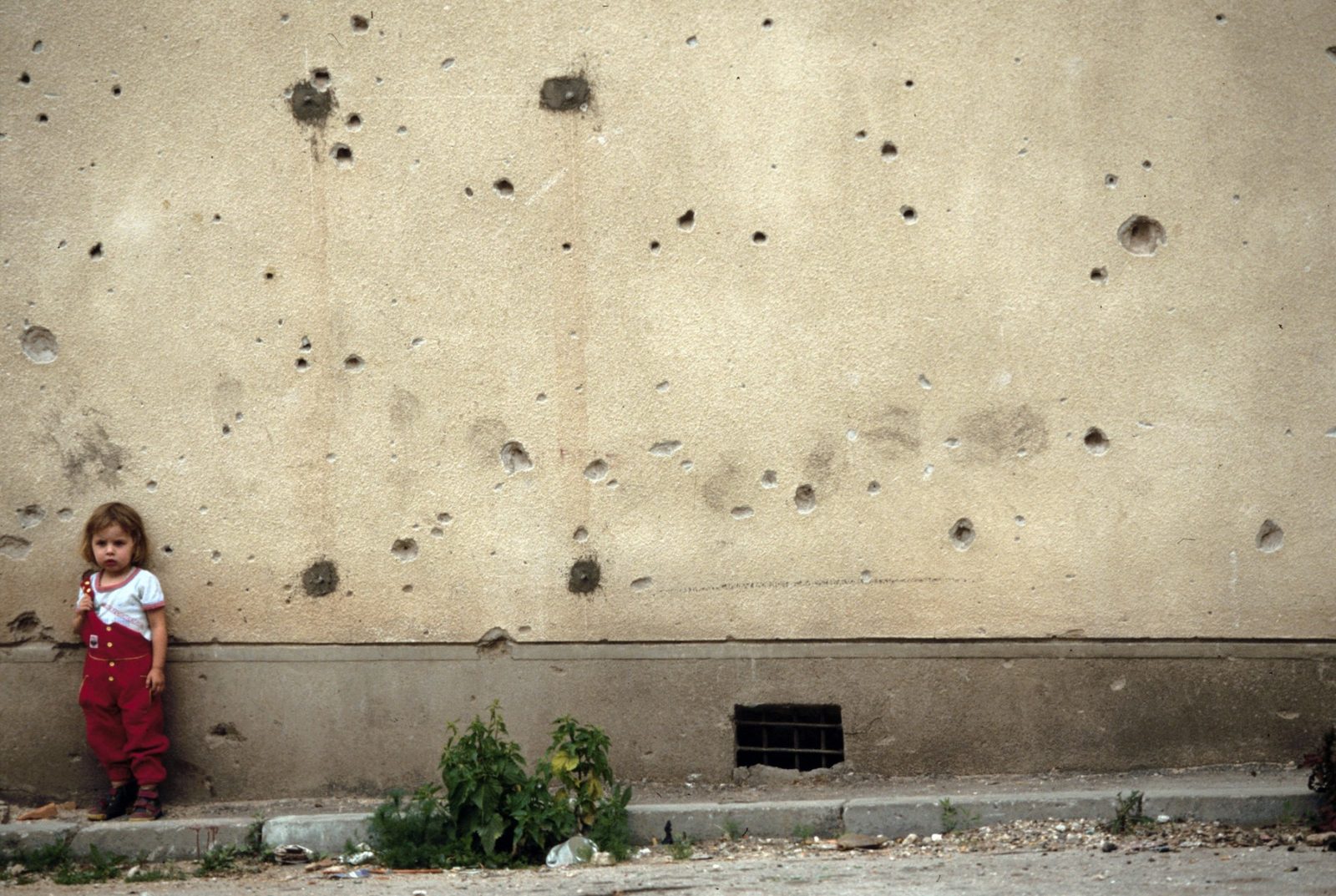 Sarajevo, Bosnia 95 The snipers, shooting from small holes made in the walls of the buildings or from the bushes, had wounded 1030 and killed 255 persons, 60 of whom were children. Every area of the city was a dangerous zone. At every moment from all the places in the mountains surrounding the city the snipers could hit every target in the city.