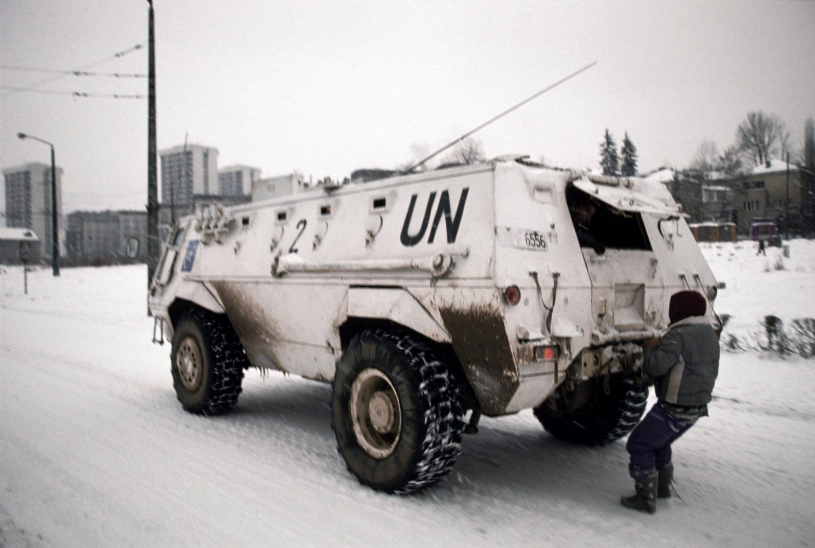 Sarajevo, Bosnia. 93/94The airport was officially controlled by UNPROFOR. It was used by military planes with humanitarian aid for the city, foreign journalists, artists, politicians, mediators, diplomats and the citizens of Sarajevo with UN Press or UNHCR cards. The airport was opened or closed depending on the Serbs shelling or their guarantees of safety in accordance with their current political or military aims. In reality the Serbs controlled the airport.The role of the UNPROFOR was manifold. They served as hostages to the Serbs, they cleared the garbage, they rode in APC as a protection against snipers, they gave out sweets, brought flour, destroyed the surface of Sarajevo streets with their tanks and transporters, representing the only city transportation through a long period, they repaired electrical transmissions lines, they controlled the airport ... The most important form of the protection of citizens was driving the APC next to them shielding them from the sniper fire while they were crossing the Tito street. For a long time they were the most significant part of the city's commercial life because they were trading the goods available to them.
