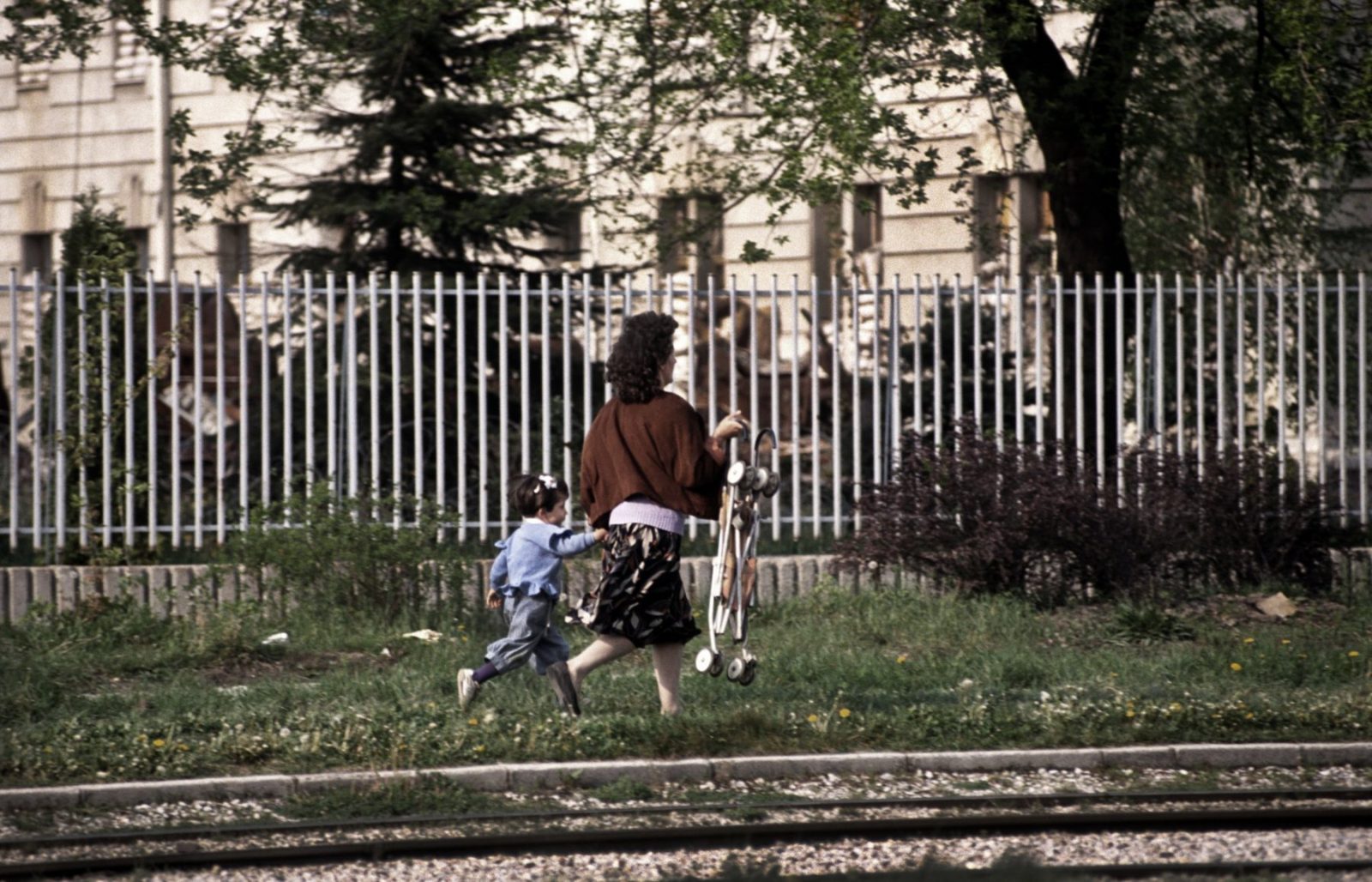 "Sniper Alley" A mother and child run for their lives to avoid being hit by incoming Serb sniper fire. Sarajevo, 1995