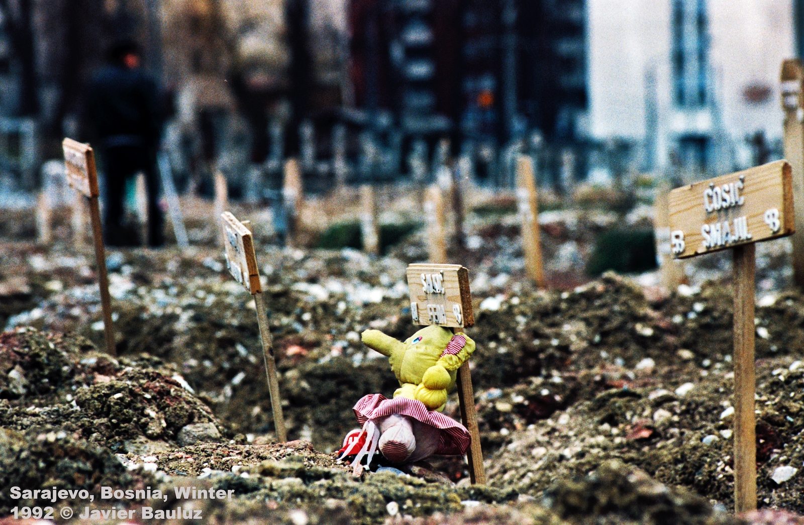 Grave with the stuffed elephant of a Bosnian boy killed in a Serb attack. Sarajevo Bosnia and Herzegovina, Winter 1992.