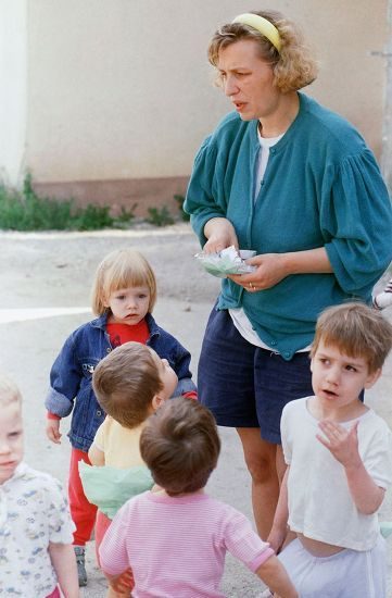 Mandatory Credit: Photo by Jockel Finck/AP/Shutterstock (7256653b) An unidentified nurse gives sweets to orphans in the town of Stup near Sarajevo, on . Two of 50 orphans on a relief bus to Germany were killed by a sniper attack Saturday evening. The bus with the remaining orphans is now on its way to Split, Croatia Bosnia Herzegovina Civil War People, Sarajevo, Bosnia and Herzegovina