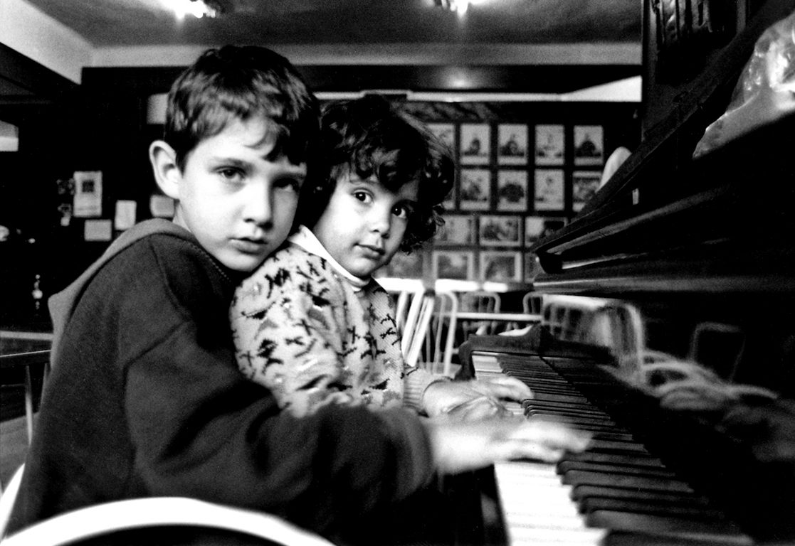 Two young members of the Jewish Community hidden in the basement of the Synagogue due to heavy bombing. Sarajevo, Bosnia and Herzegovina, 1995