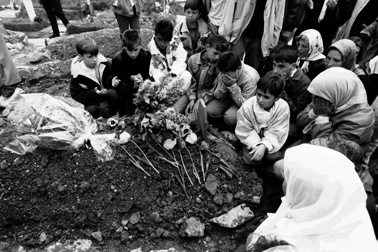 Funeral of a sixteen year old Amel Hodzic who was killed by a Serb sniper while playing tennis with his friend. 6 May 1995, Martyrs' Cemetery Kovači - Sarajevo, Bosnia and Herzegovina