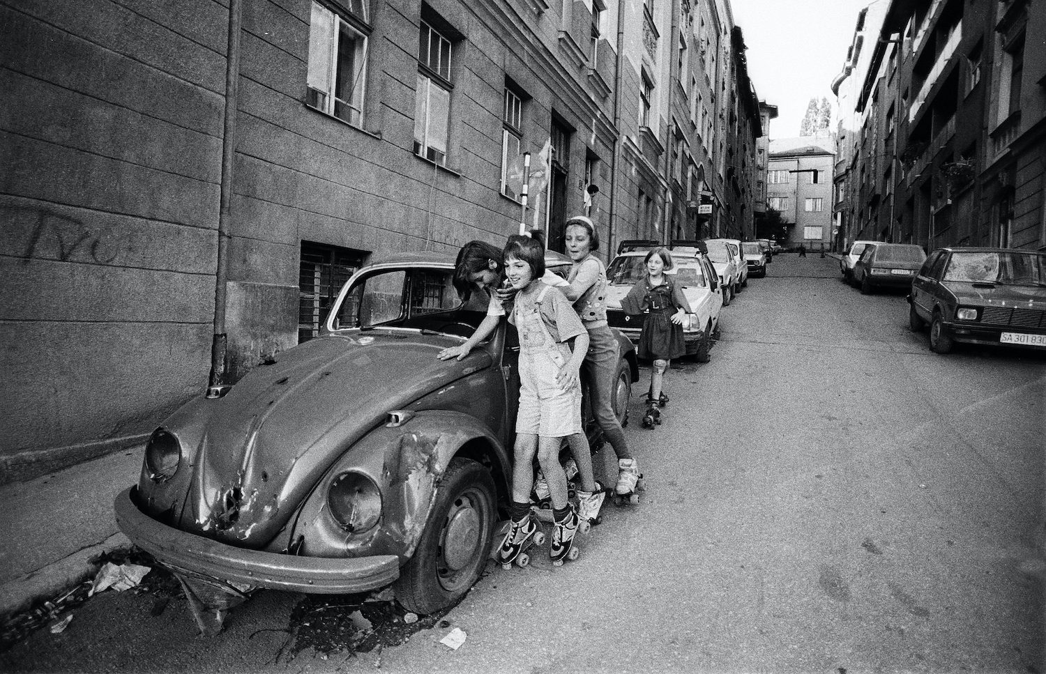 Some girls are skating during a cease fire time in the centre of Sarajevo. Sarajevo, Bosnia and Herzegovina, August 1993