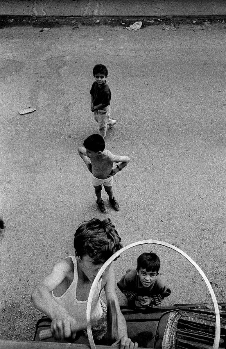 Some boys while reparing a basket in order to play in the perifery of Sarajevo. Sarajevo, Bosnia and Herzegovina, July 1995