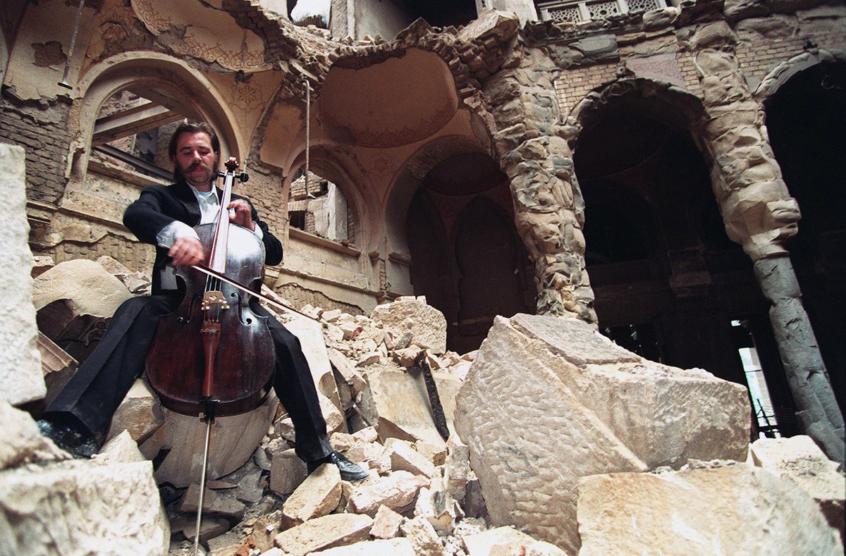 Vedran Smailovic, "The Cellist of Sarajevo", playing in the destroyed Sarajevo National Library in 1992.