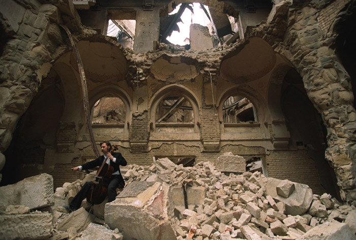 Vedran Smailovic, "The Cellist of Sarajevo", playing in the destroyed Sarajevo National Library in 1992.