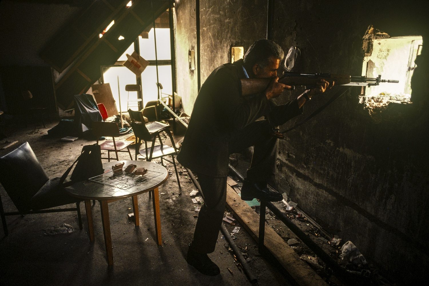 Bosnian Serb soldier in a school that marks the front line in the Serb-controlled area of Gabivica, Sarajevo, September 1992