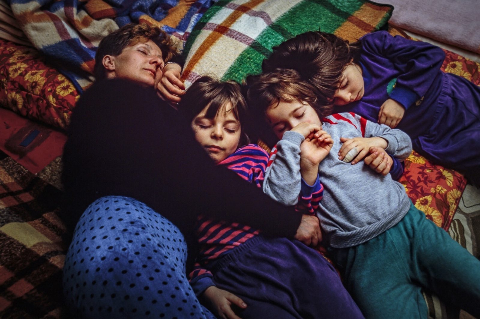 A Bosnian refugee family sleeps in an underground basement, sheltered from bombardments. 13 Jul 1992, Sarajevo, Bosnia and Herzegovina