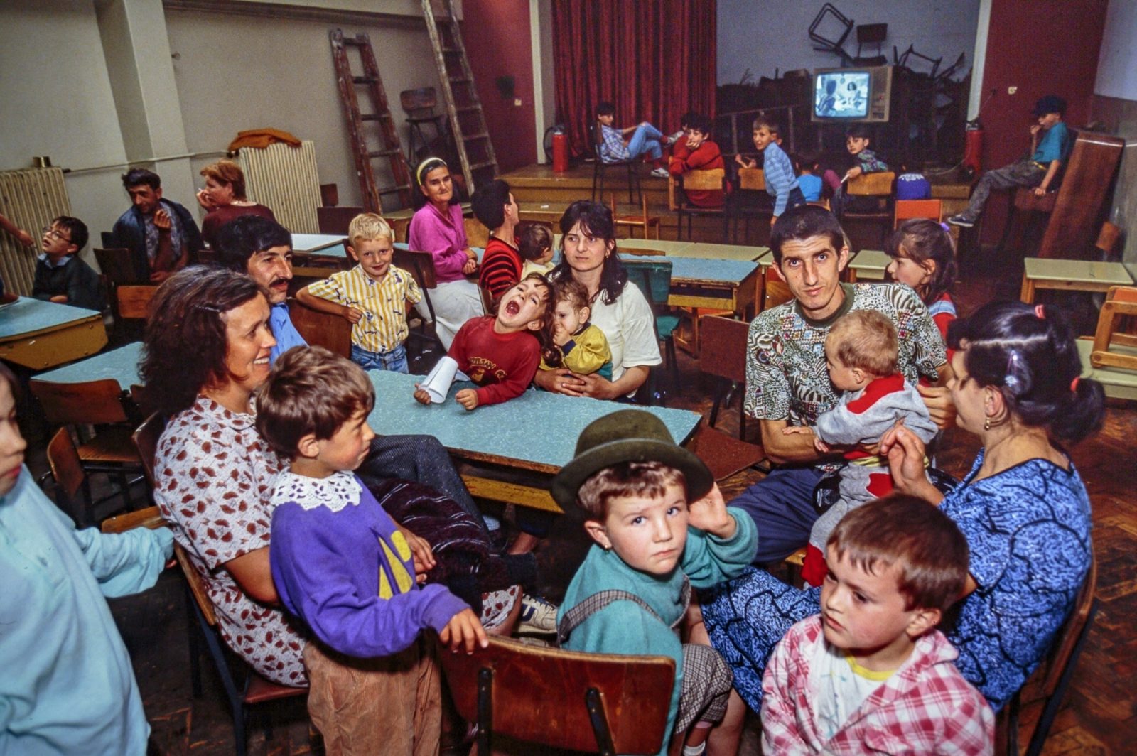 Young Bosnian refugees sleep on cots in a room of an old school. 13 Jul 1992, Sarajevo, Bosnia and Herzegovina