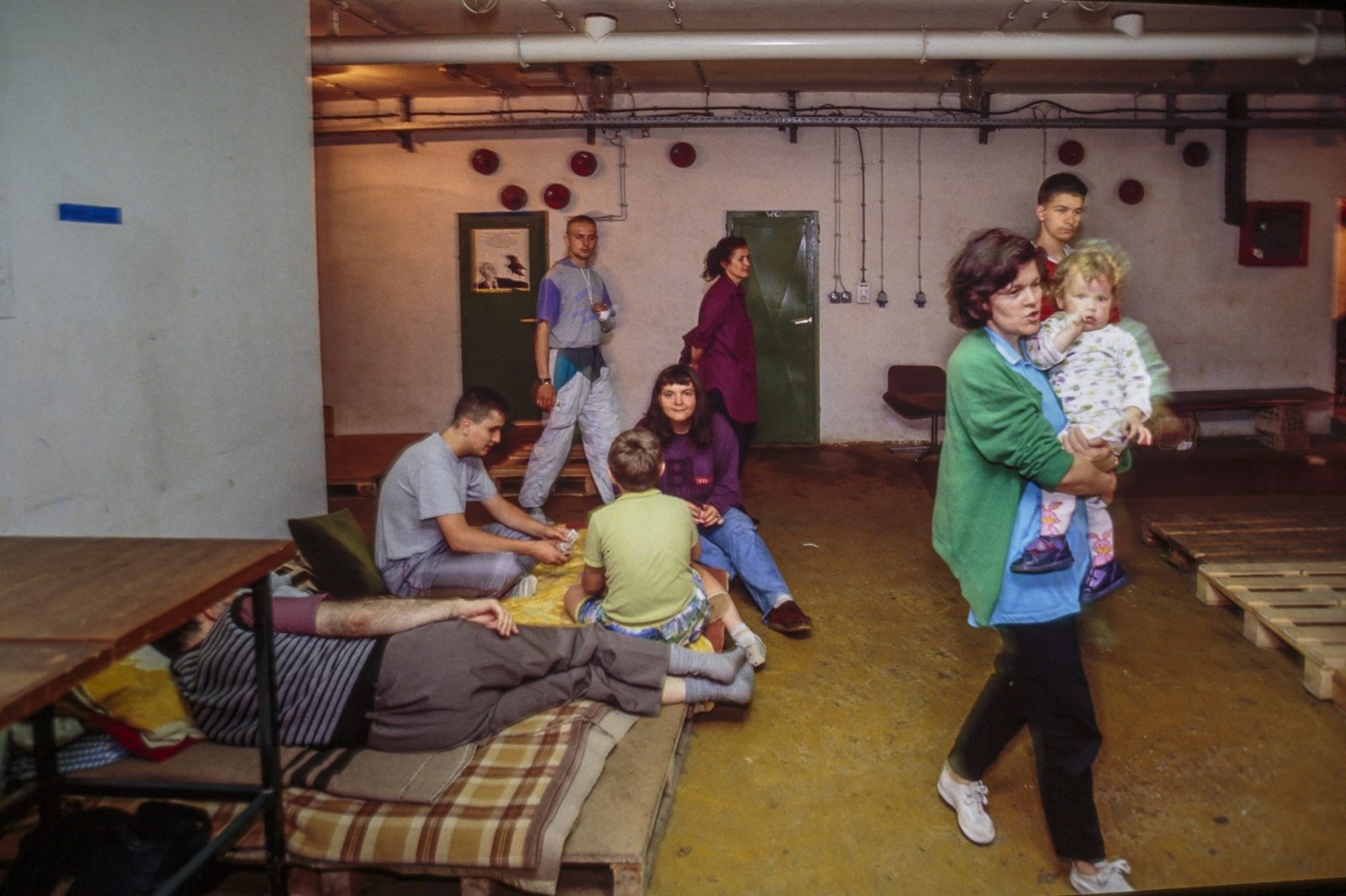A Bosnian refugee family sleeps in an underground basement, sheltered from bombardments. 03 Aug 1992, Sarajevo, Bosnia and Herzegovina