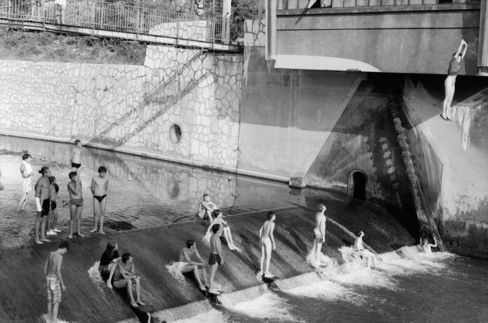 Summer 1993, Sarajevo, Bosnia and Herzegovina. Swimming in the Miljacka during a ceasefire.