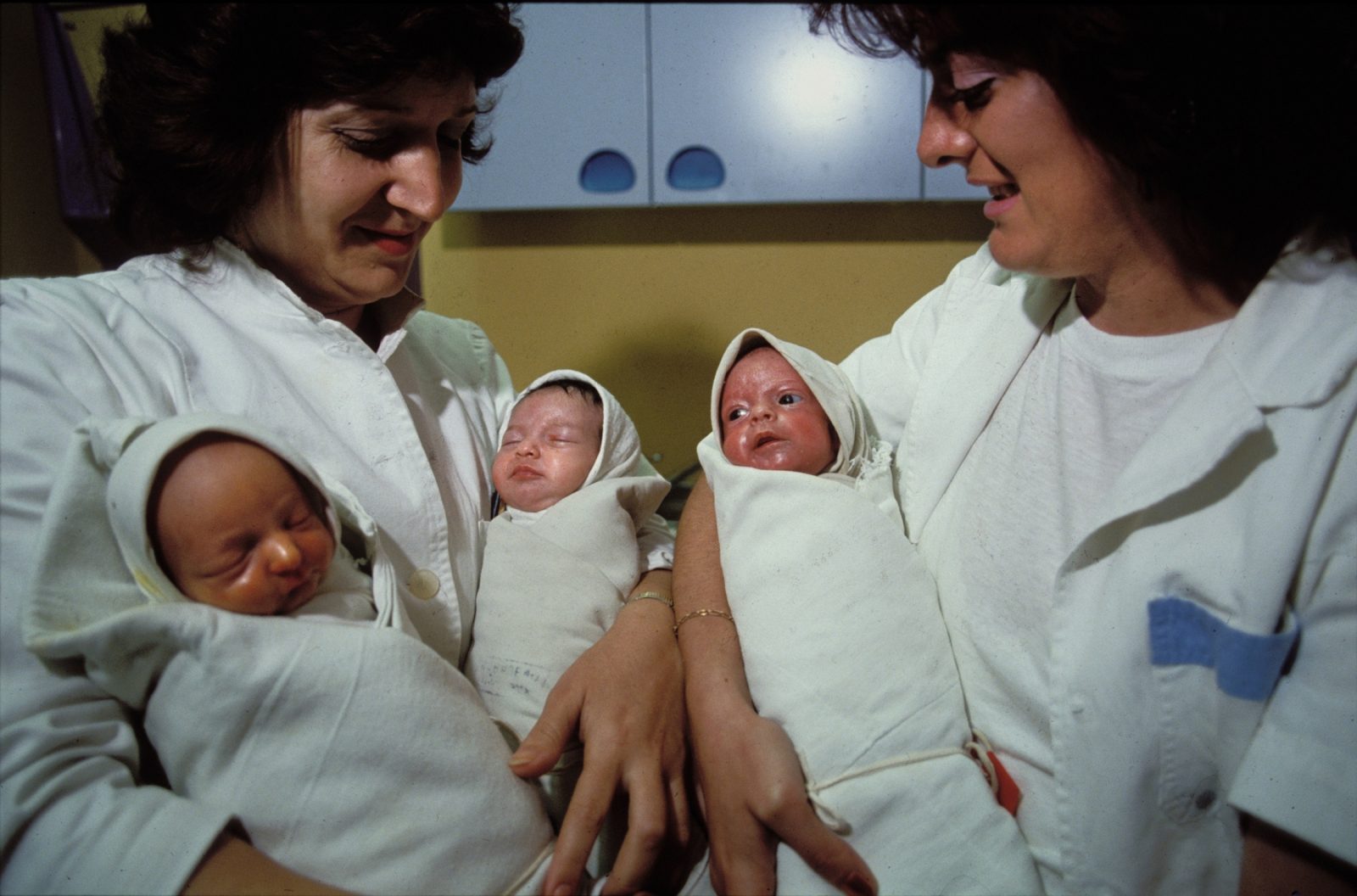 Neonatal nurses hold newborn babies at Kosevo Hospital during the Bosnian Serb siege of Sarajevo, Bosnia and Herzegovina, September 1992. Almost 2,000 children, and over 10,000 people in total were killed in Sarajevo during the 3-1/2 year siege.