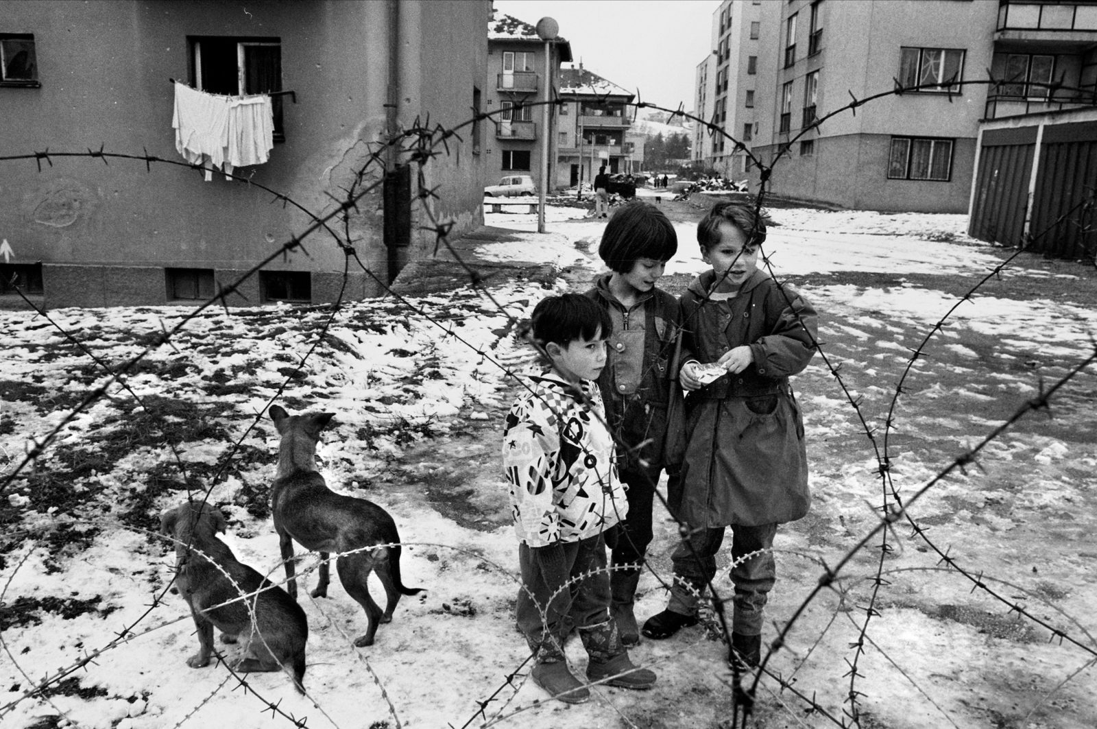 Serb children outside a camp for Italian NATO soldiers in the suburb of Vogosca, Sarajevo, Bosnia-Herzegovina, February 1996.