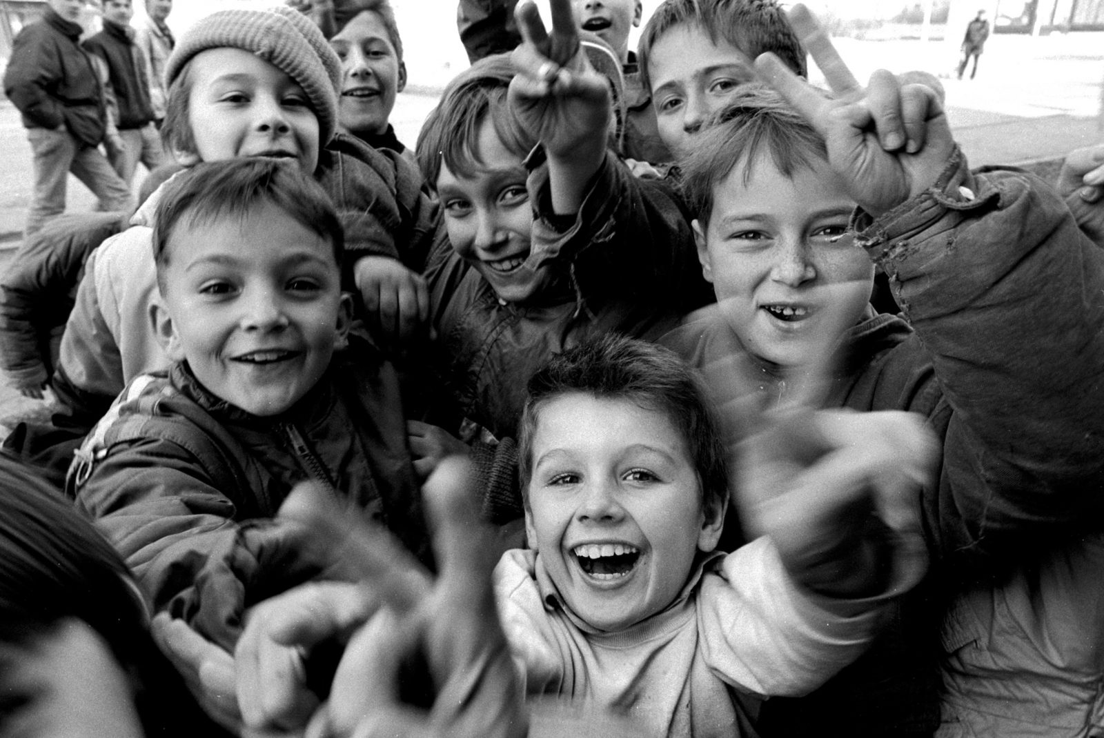 Children flash victory signs at the photographer, Sarajevo, Bosnia-Herzegovina, February 1993.