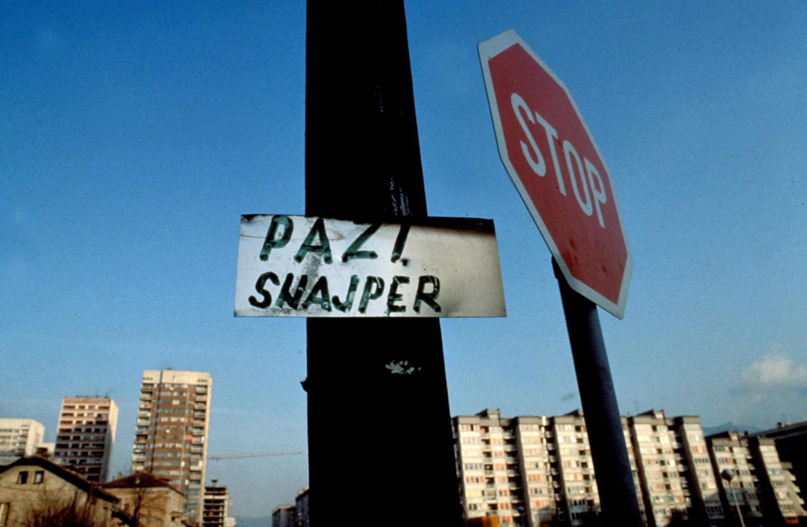 A warning sign for pedestrians at an exposed intersection where a Serb sniper shoots during the Bosnian Serb siege of Sarajevo, Bosnia and Herzegovina, December 1992. Almost 2,000 children, and over 10,000 people in total were killed in Sarajevo during the 3-1/2 year siege.