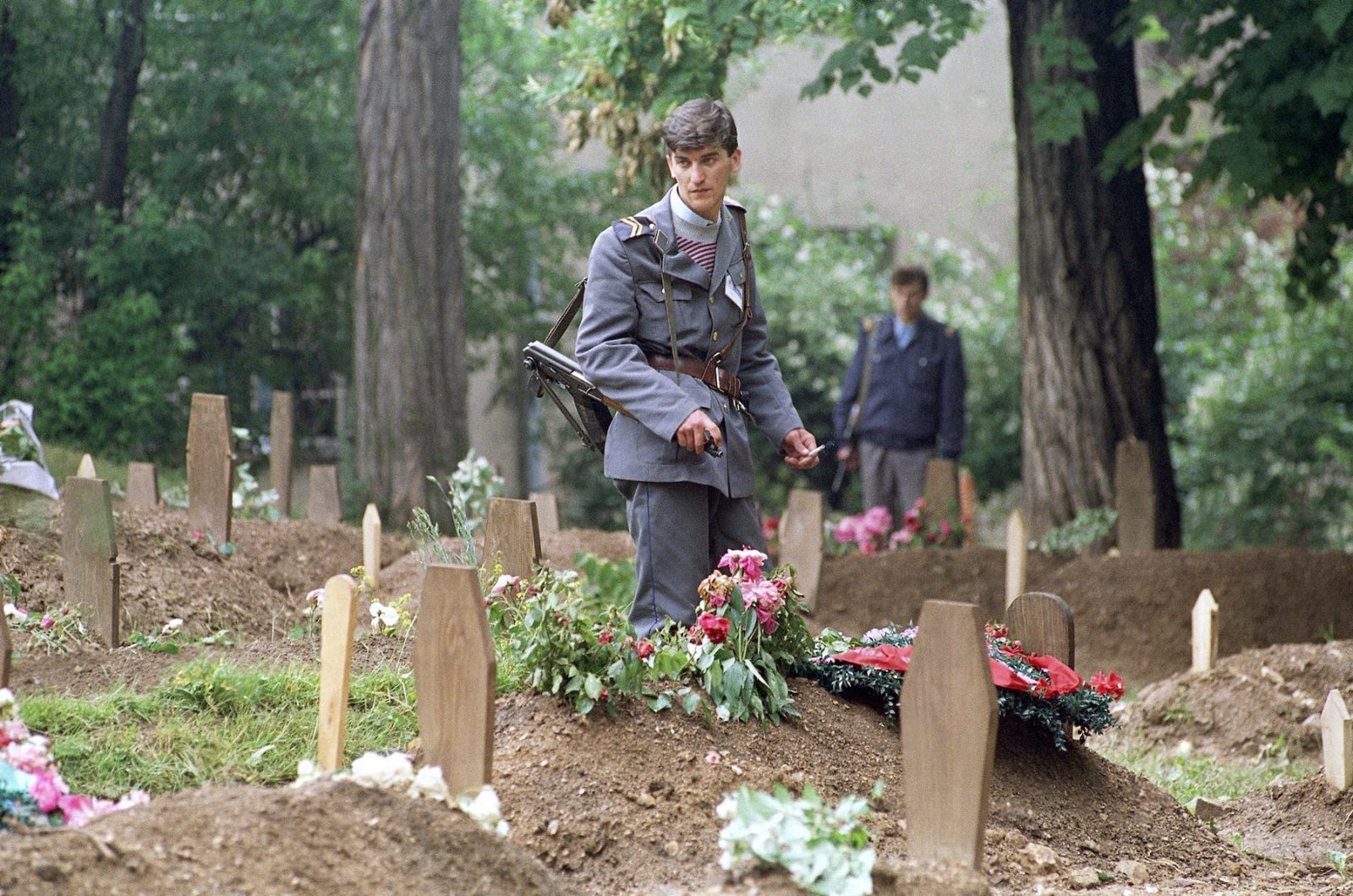A Bosnian man pauses in Sarajevos military graveyard on Tuesday, June 16, 1992, after visiting a friends grave. A cease-fire between Serbian and Bosnian forces seems to be holding, allowing residents of this city to bury their dead and come out onto the streets.