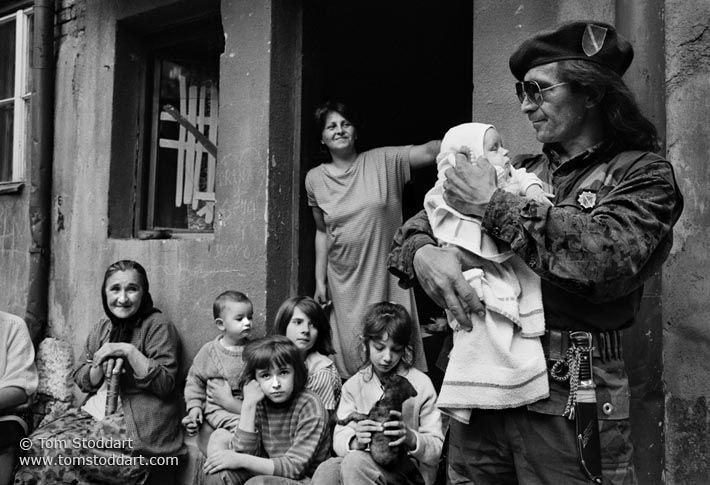 Bosnian soldier Sead Hamzic holds his 53 day old goddaughter Amila outside the family home in Sarajevo shortly before going off to the frontline to fight against Serb forces besieging the former Winter Olympics city. (Photo by Tom Stoddart/Reportage by Getty Images)
