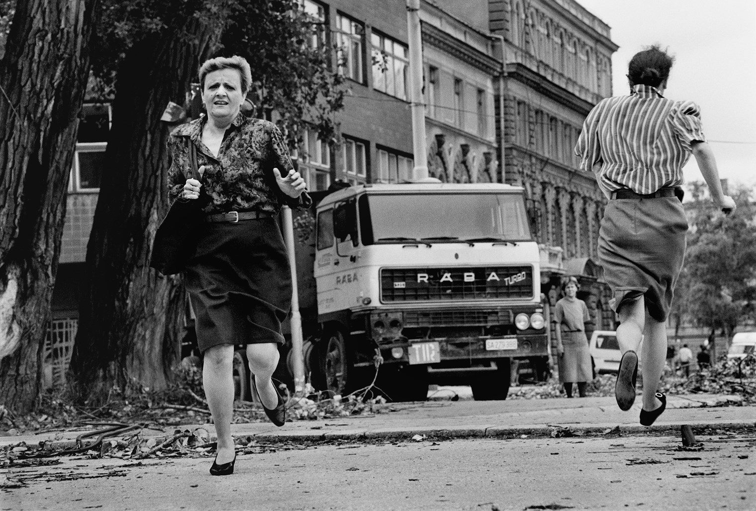 Sarajevo, 1992. Women run for their lives across 'Sniper Alley' under the sights of Serb gunmen during the siege of Sarajevo. (Photo By Tom Stoddart/Getty Images)